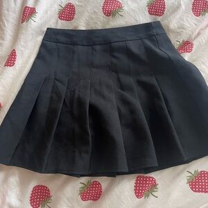 black pleated mini skirt